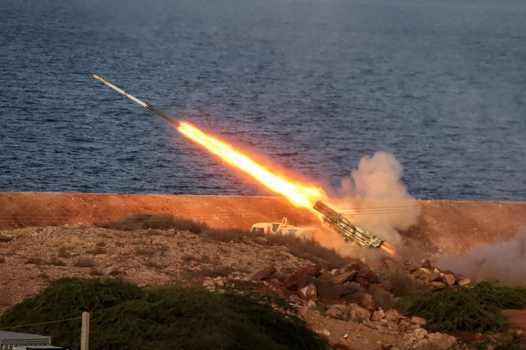 A missile being launched with fire and smoke during the 'Great Prophet 17' joint exercise in southwest Iran