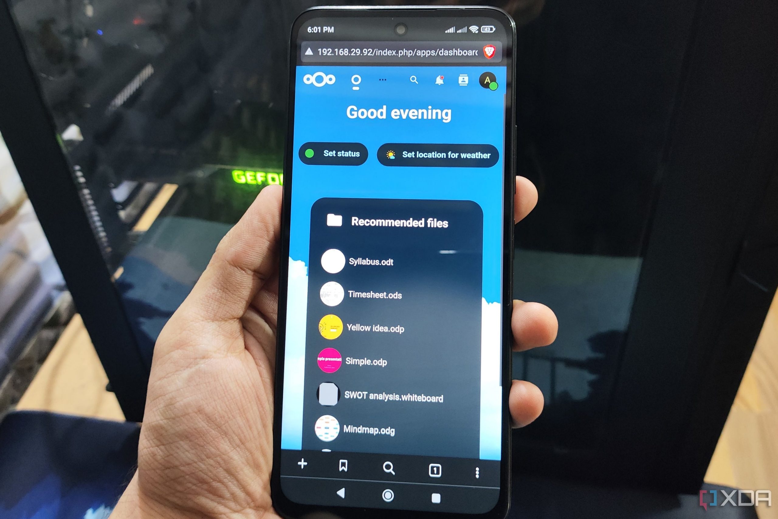 The Nextcloud UI displayed on a Poco M6 Pro, with a PC in the background